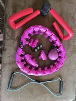 All items laid out: hoop segments, weighted ball, push-up grips, resistance band