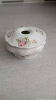 Top view showing lid opening and floral decoration