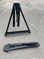 Easel folded and unfolded on ground