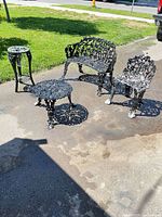 Full set showing bench, chair, round table, tall stand