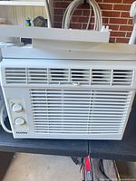 Front view of Danby window air conditioner showing grille and controls