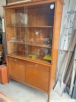 Full view of Drexel Counterpoint china cabinet showing glass-front upper display and lower storage