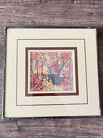Front view of framed Tom Thomson print showing artwork, mat and frame condition