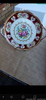 Top view of handled Lady Hamilton plate showing pattern and condition