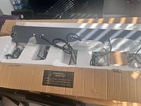 Fixture in protective foam with cords visible inside box