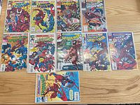 All 11 bagged and boarded Maximum Carnage issues laid out on table
