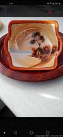 Front view of Noritake lusterware dish showing scenic design