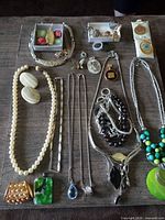Full layout of jewelry pieces on table