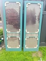 front view of both teal and white screen panels standing side by side
