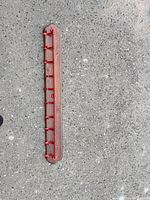 Full view of entire rack showing length, wood backboard and red hooks
