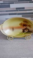 Oval hand-painted Nippon bowl showing sailboat and cottage scene
