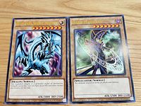 Fronts of both XL cards showing artwork and stats