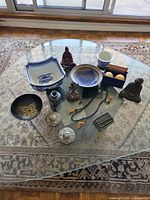 Group shot of all thirteen Far Eastern items on glass table