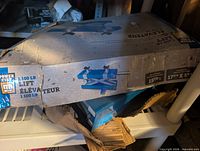 Original box showing brand Power Fist and 1,100-lb lift rating