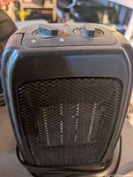 Top view of heater showing dual control knobs and indicator light