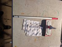 Unboxed Duop dust mop showing handle, swivel head and microfiber pads