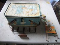 Tin, coat rack and wood figure grouped