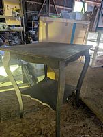 Side table with cabriole legs and lower shelf