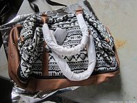 Realer geometric print handbag with tan faux leather, handles wrapped