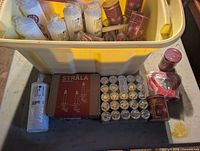 Overall lot in bin showing candles, light set, tealights, napkin holders