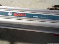 Close-up of Bosch BT160 Professional label on folded tripod