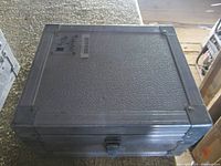 Closed aluminum case showing exterior texture, edges and latch