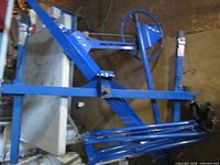 Blue drywall lift showing structure and crank mechanism
