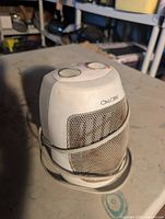 Front view of Calore ceramic heater showing controls, grille and cord