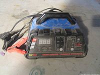 Front view showing EverStart charger, clamps, digital display and labels