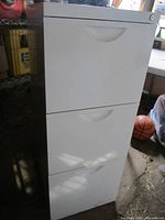 Full view of white three-drawer filing cabinet