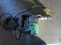 Full view of Hitachi corded rotary hammer drill with cord and plug visible