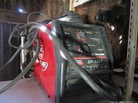 Front view showing control panel and cables of Lincoln Electric SP-135T welder