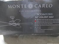 Factory sealed box showing Monte Carlo branding, model 5COM52BS, 52" Colony Max details