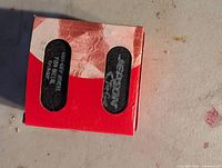 Red Jepson pack front view showing two blades through windows