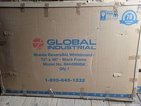 Sealed carton showing Global Industrial Mobile Reversible Whiteboard 72 x 48 details