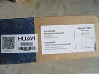 Box label showing brand Huayi, model VJE168278C and product type single lever washbasin mixer