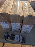 Three Weiser shipping cartons and one retail blister pack showing model label