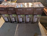 Front view of five boxed lanterns