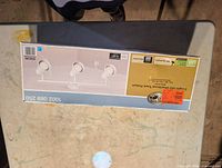 Front of sealed box showing product image and model details