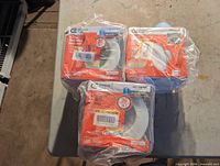 Three boxed Commercial Electric LED recessed downlights in shrink wrap