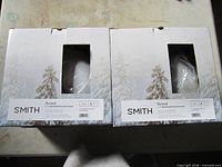 Two Smith Scout helmet boxes showing model and size