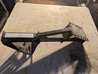 Full view of metal spare tire mount showing overall design