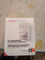 Front of boxed Honeywell thermostat showing product details