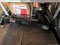 CargoMaster steel crane arm sections with capacity markings 2000 lb and 1000 lb visible
