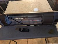 Full view of heater with remote on table