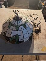 Dome stained glass pendant showing leaf and grape design with ceiling mount and wiring