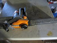 Full view of Worx electric chainsaw on table
