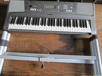 Top view of Yamaha electronic keyboard with stand parts