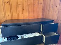 Front view with drawers partially open showing six-drawer layout