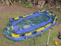 Full view of partially inflated Intex Seahawk 400 raft on grass